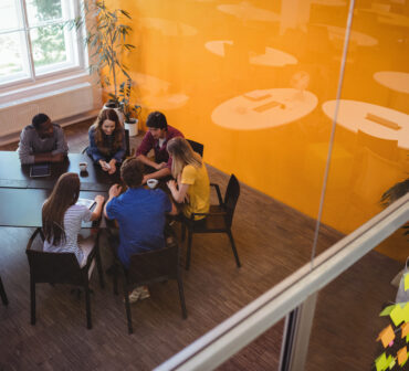Pakistani startup founders brainstorming in a co-working space, symbolizing revival of innovation