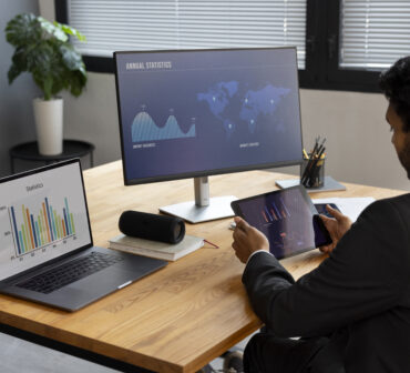 Pakistani startup founder analyzing funding data during a market slowdown.