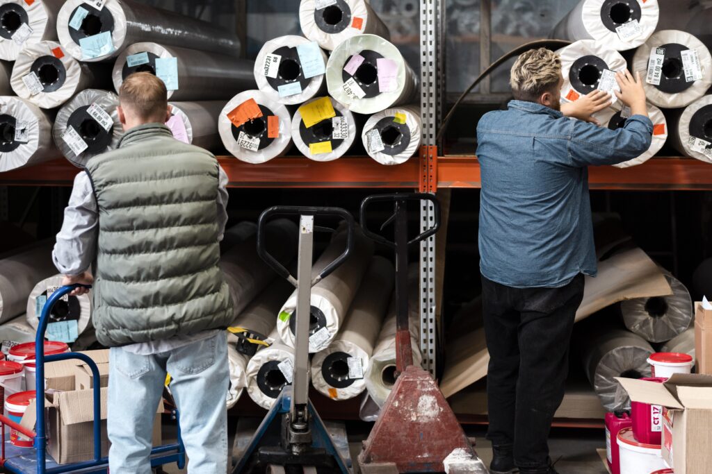 Colorful fabric rolls ready for export, symbolizing Pakistan’s textile sector and global trade.